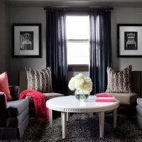Red pillows in a gray room