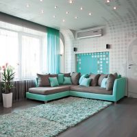 The combination of turquoise and gray in the interior of the living room