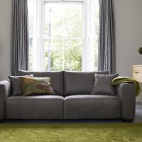 Green carpet in a gray living room