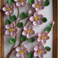 Twig with flowers in a quilling painting