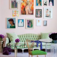 Paintings with women on a pink wall