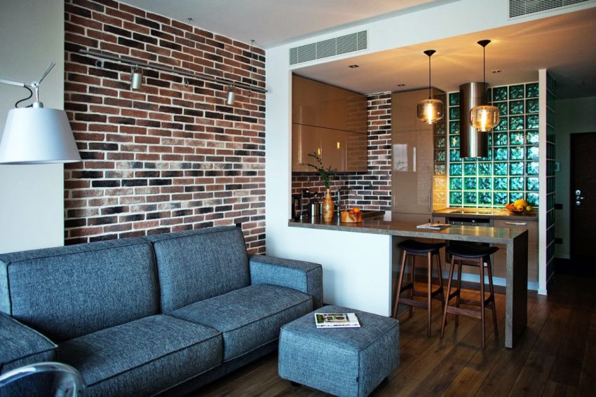 Brick wall in the design of the kitchen-living room