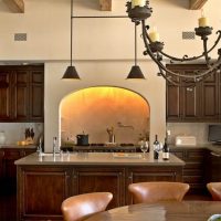 Arched hood in the interior of the kitchen-living room