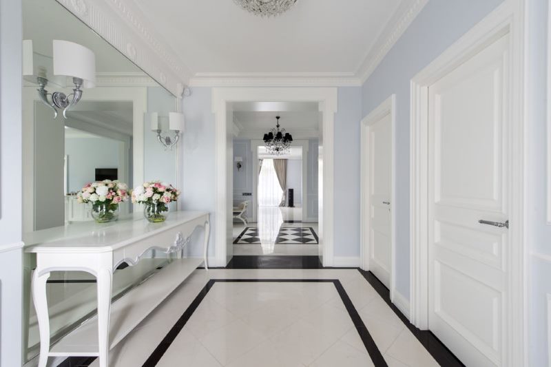 Interior of a corridor with white tile floor
