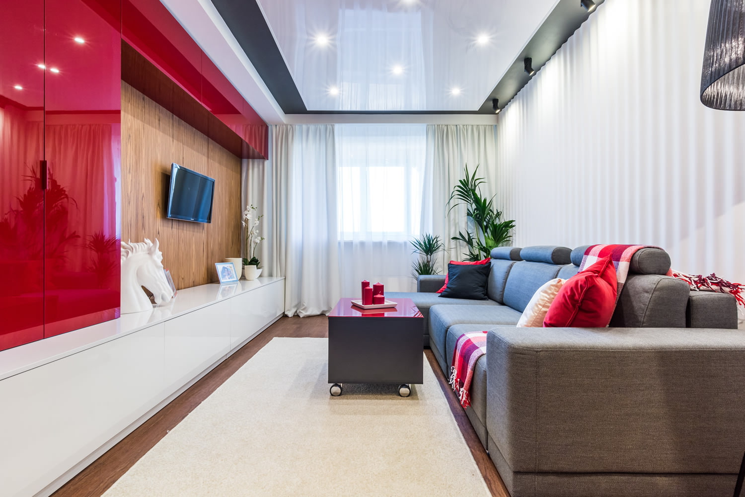 Red and white wall in a narrow living room