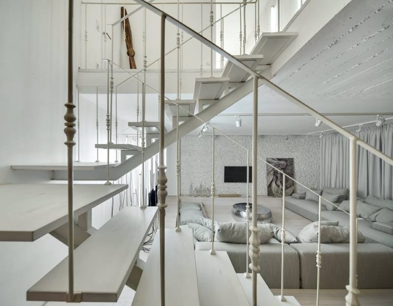 Metal railing of an interfloor staircase in a city apartment