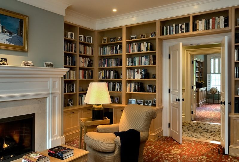 Home library design with fireplace