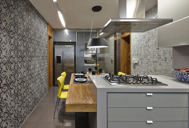 Two yellow chairs in the kitchen with gray wallpaper