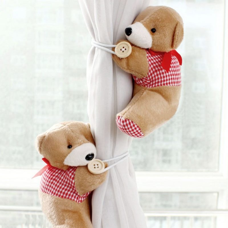 Teddy bear pickups on curtains in a nursery