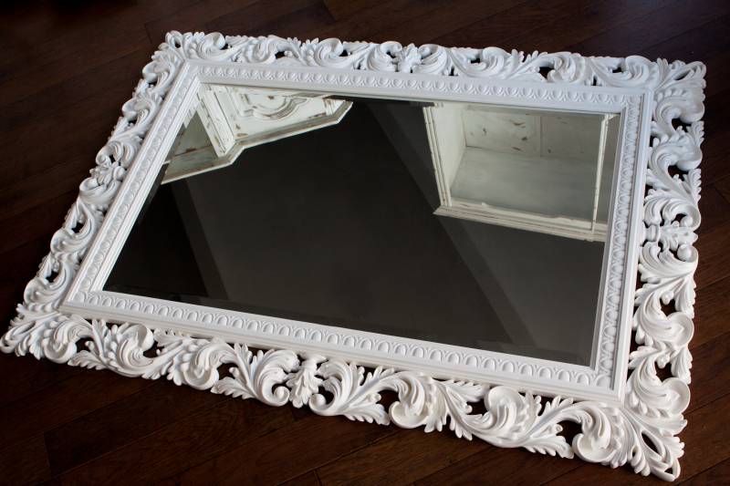 Stucco mirror in white frame