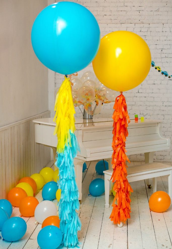 Yellow and blue balloon in a white room