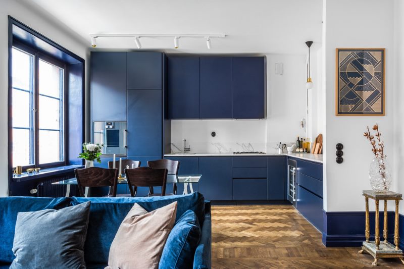 The interior of the kitchen-living room in blue and white