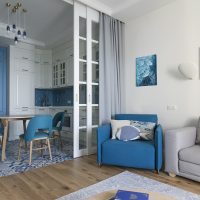 Blue color in the interior of the kitchen-living room