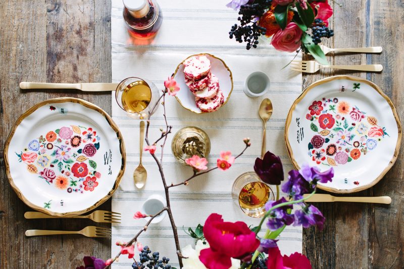 Beautiful plates with bright patterns on the festive table