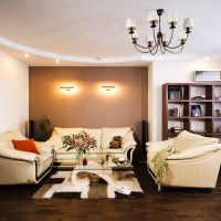 Living room design with three sofas