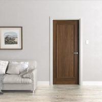 Brown door in a white room