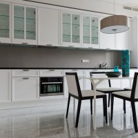 Upholstered chairs in a linear kitchen