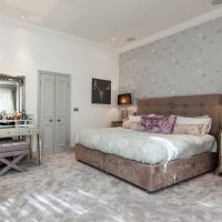 bedroom interior with floral wallpaper