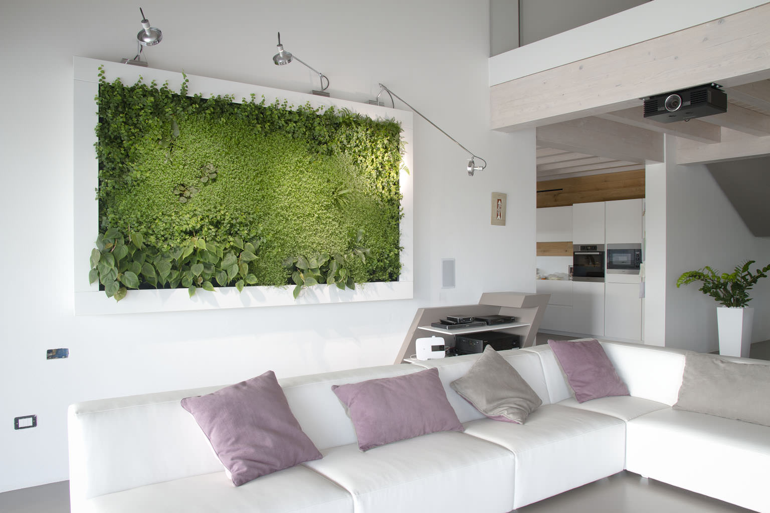 Panel of green grass on the wall of a room in a studio apartment