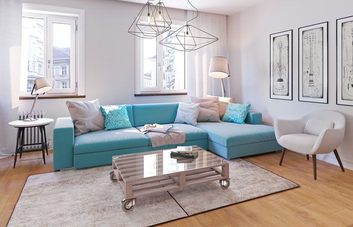 Turquoise sofa in the living room of a country house