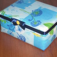 Blue ribbon with a bow on a cardboard box