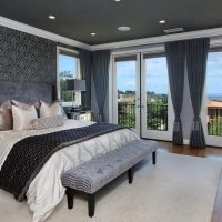 Gray ceiling in a spacious bedroom