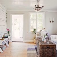 White living room with garden door