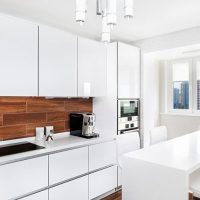 Snow-white kitchen of direct planning