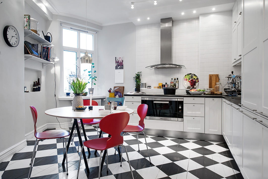 Bright red chairs in a Scandinavian style kitchen