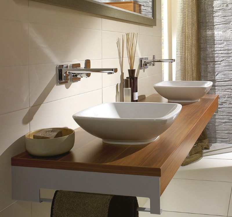 Two surface sinks with wood trim