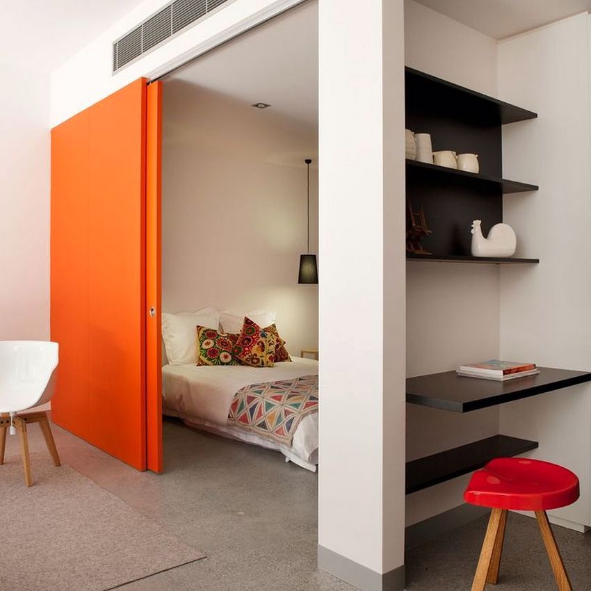Orange sliding partition between the bedroom and the living room