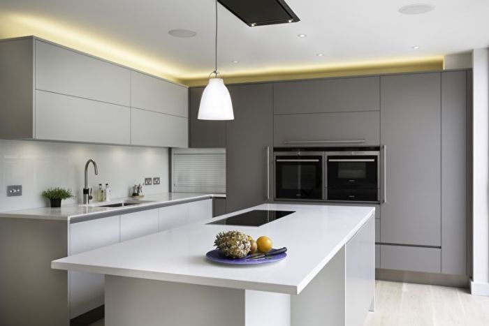 The kitchen is in the style of minimalism.