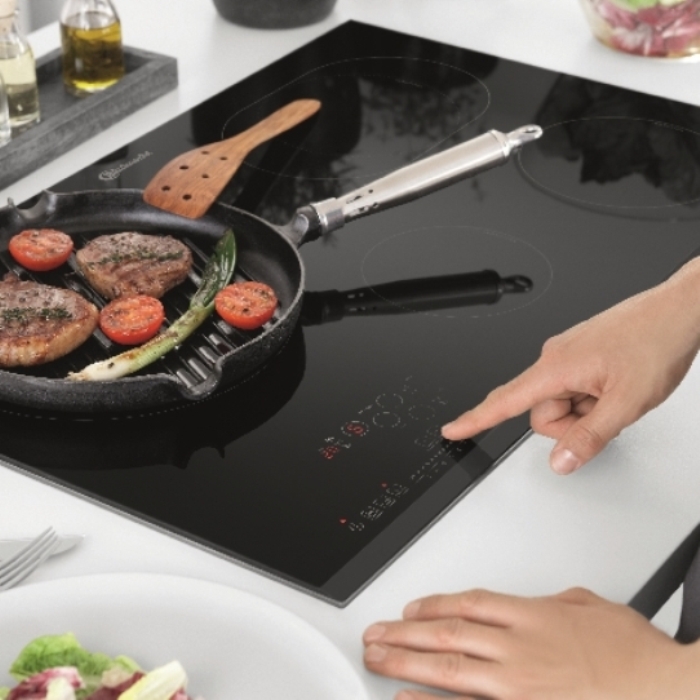 The method of operation of the induction cooker.