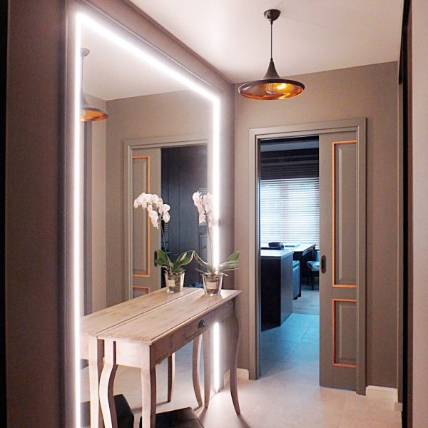 Mirrors should be well lit. Firstly, in this way they will give a real reflection, and secondly, by reflecting the light, they will also make the space wider.